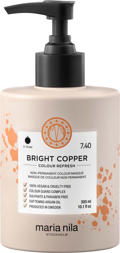 Beige pompflacon met zwarte tuit, gemarkeerd 'Bright Copper' voor haarkleur, van Maria Nila.