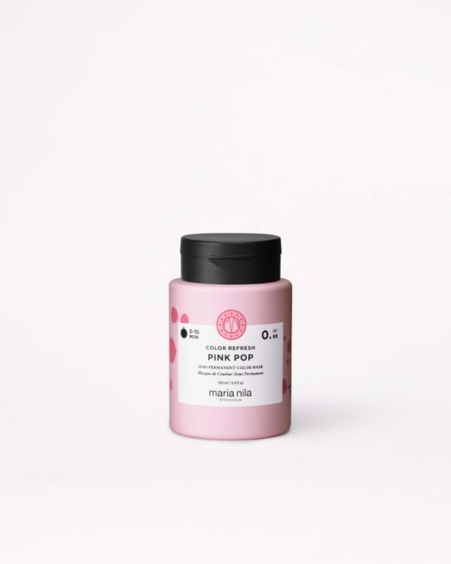 Eine rosa Flasche mit Pigmentfarbe namens Pink Pop von Maria Nila, mit schwarzem Deckel und schlichtem Etikett.