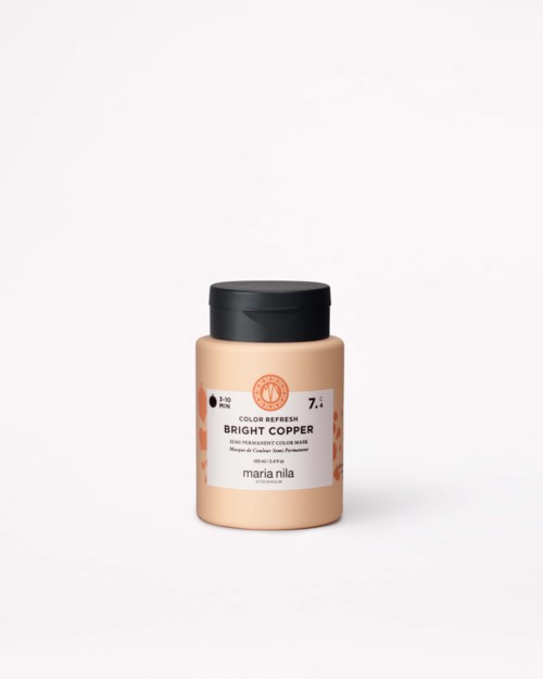 Ein kleiner beiger Behälter mit schwarzem Deckel, beschriftet 'Bright Copper' von Maria Nila, auf weißem Hintergrund.