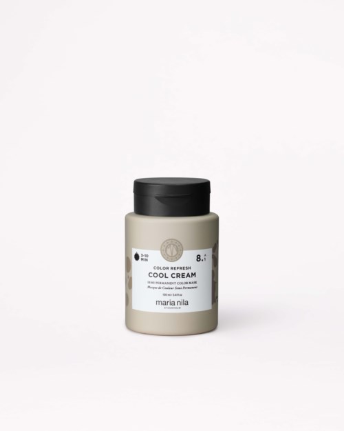 En burk av Marie Nila Cool Cream med beige kropp och svart lock mot vit bakgrund.