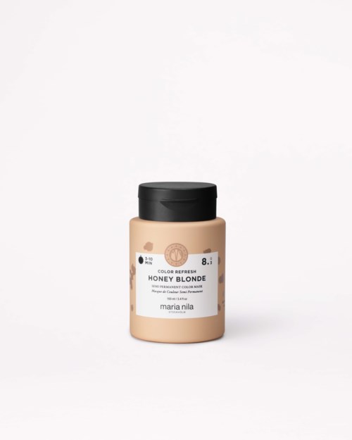 A jar of honey blonde hair dye with a black lid and white label on a white background.
