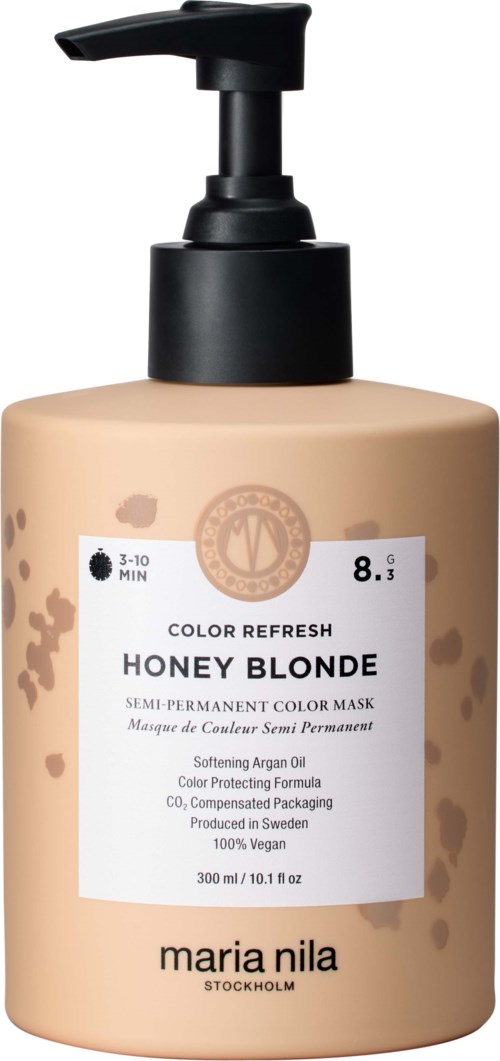 Eine Flasche Haarfarbe 'Honey Blonde' von Maria Nila, mit Pumpkopf, weißem Etikett und beiger Flasche.