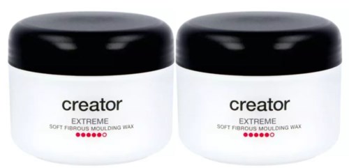 Två vita burkar med svarta lock märkta 'creator extreme' för mjukt fiberrikt formvax.
