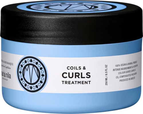 A blue and white jar labeled Coils & Curls Treatment for hair. It is vegan and animal free.