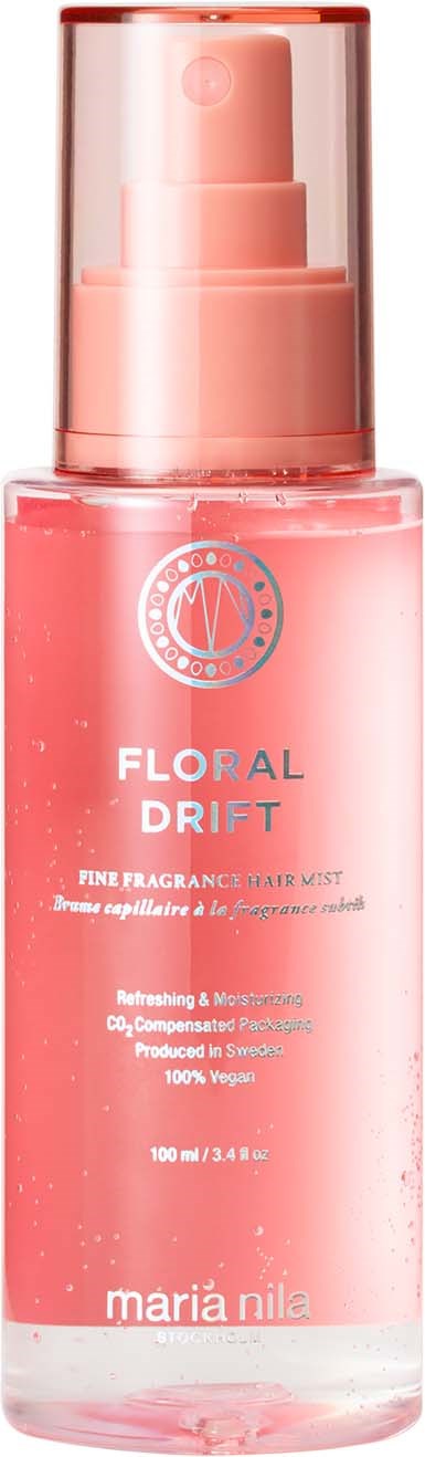 A pink floral-scented skincare spray bottle with a clear cap and a pump dispenser.