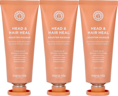 Tre peachfärgade tuber av Maria Nila Head & Hair Heal Booster Masque för hårvård, står upprätta med öppnade lock.