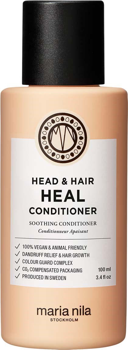 Fles Heal conditioner voor haar en hoofdhuid, met zwarte dop en duidelijke label.