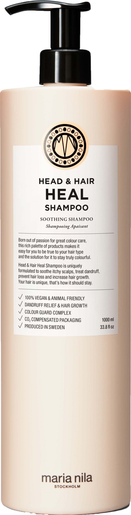 A tall, beige bottle of Head & Hair Heal Shampoo with a black pump, label showing product details and logo.