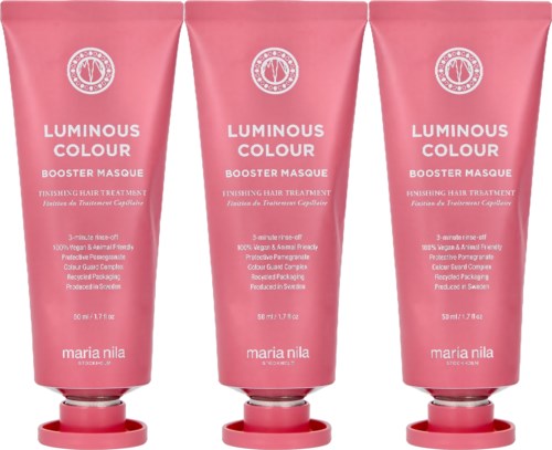 Drei pinke Tuben mit weißen Texten für eine Haarpflegeprodukt namens Luminous Colour Boosting Masque.