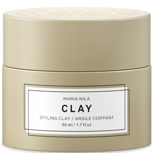 En rund beige behållare märkt 'Maria Nila Clay' med stylinglera inuti, 50 ml kapacitet.