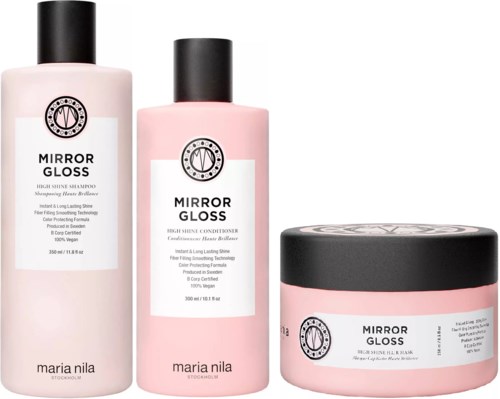 Tre rosa hårvårdsflaskor och en rosa burk med svarta lock.
