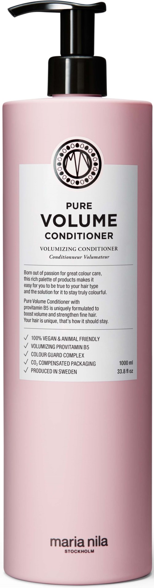 A pink bottle with a black pump labeled 'Pure Volume Conditioner' for hair, from Maria Nila.