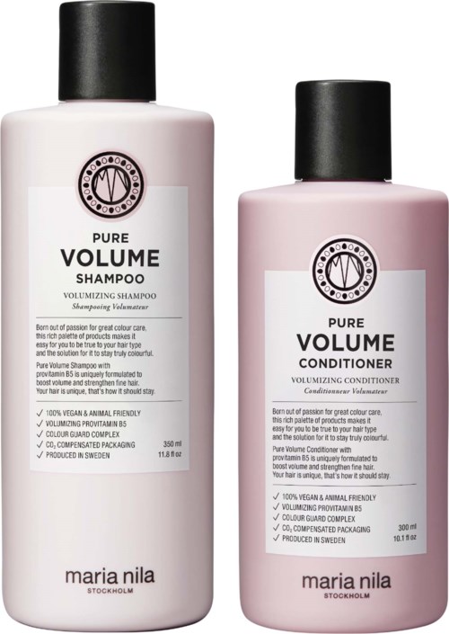 Two bottles of hair care products labeled 'Pure Volume' shampoo and conditioner, with black caps and white and pink bottles.