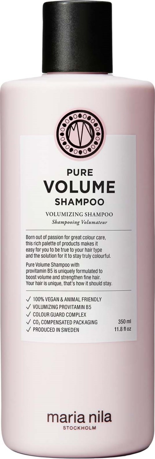 A pink bottle of Pure Volume Shampoo with a black cap, label shows brand Maria Nila and product details.