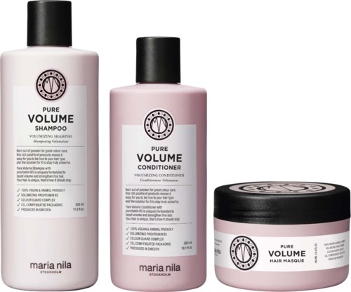 Three hair care products: shampoo, conditioner, and hair mask with black caps, pink bottles, and simple labels.
