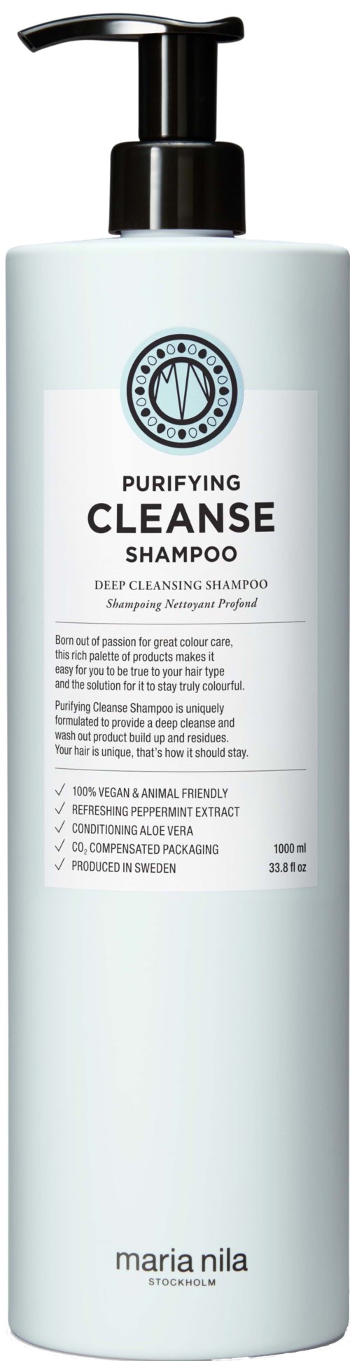 A white shampoo bottle with a black pump top, labeled 'Purifying Cleanse Shampoo' by Maria Nila, containing deep cleansing formula.
