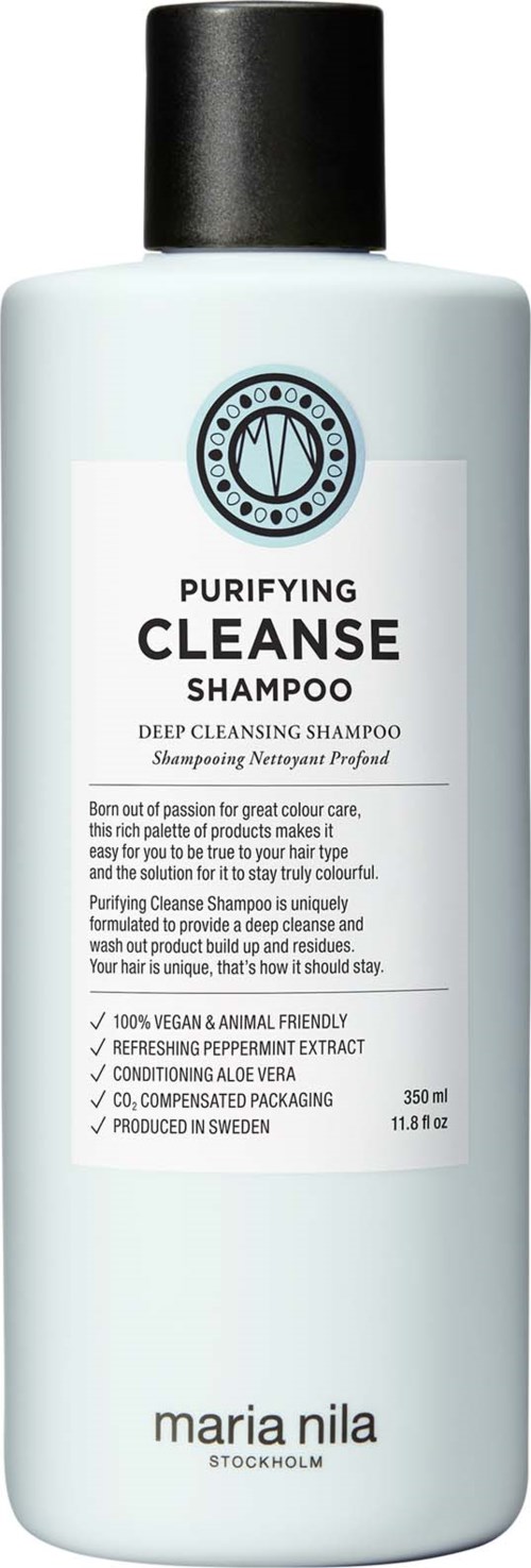 A white bottle with a black cap labeled Purifying Cleanse Shampoo, highlighting deep cleansing and natural ingredients.