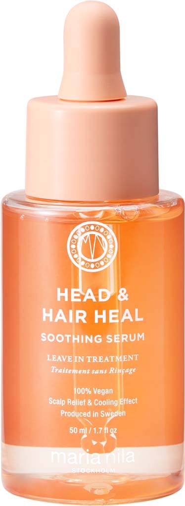 En liten orange flaska med pipettlock, märkt Head & Hair Heal lugnande serum för hårbotten.