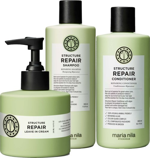 Three green hair care bottles with black caps, labeled for repair and conditioning. One has a pump, others have screw caps.