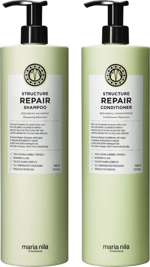 Two green bottles labeled 'Structure Repair' shampoo and conditioner. Black pump tops. White labels with black text.