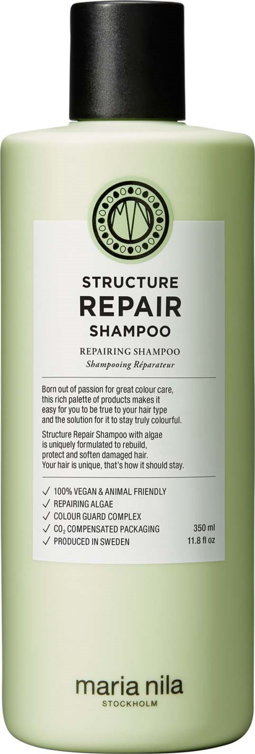 Green bottle of Structure Repair Shampoo with white label and black cap. Text describes it as a repairing shampoo from Maria Nila.