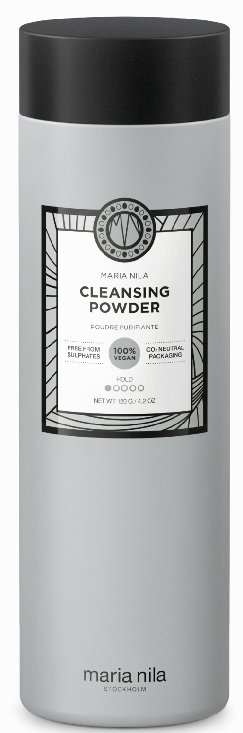 En lång vit flaska med svart lock och etikett som visar "Cleansing Powder" och varumärken.