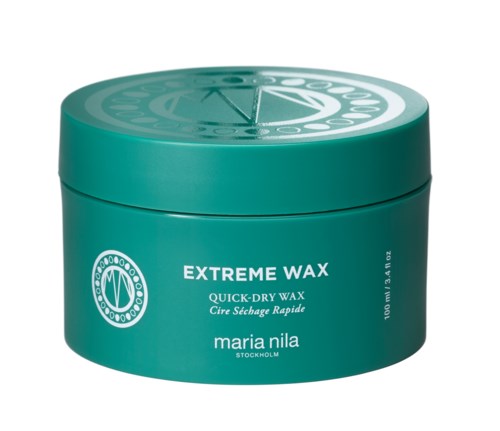 En turkos rund behållare märkt "Extreme Wax" med vit text, tillverkad av Maria Nila. Den används för frisyrstyling.