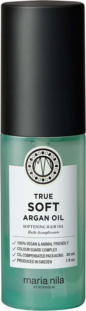 Een groene fles Maria Nila haarolie met zwarte dop, label "True Soft Argan Oil" voor zacht haar.