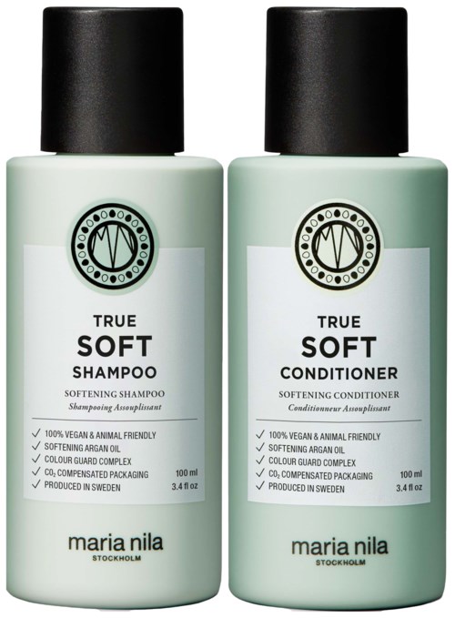 Zwei Flaschen Haarpflegeprodukte: Shampoo und Conditioner, beide mit 'True Soft' beschriftet und schwarzen Deckeln.