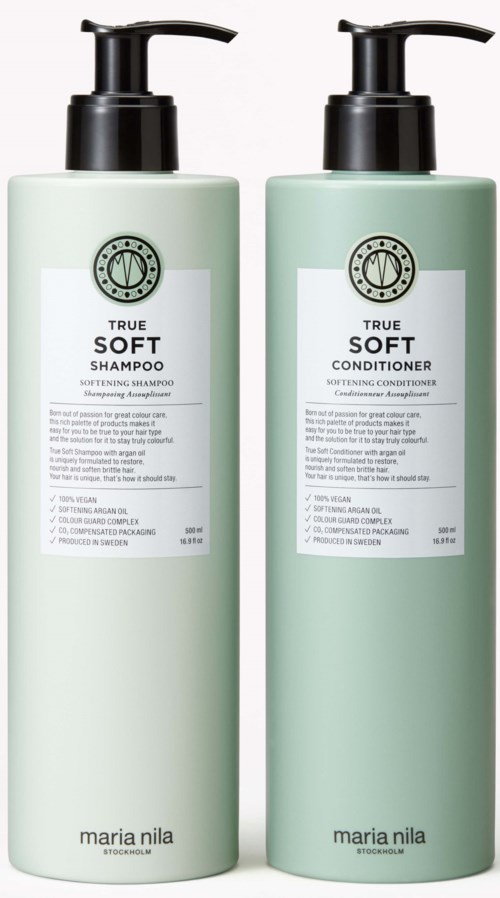 Two mint green bottles, one for shampoo and one for conditioner, with black pump tops, labeled 'True Soft' by Maria Nila.