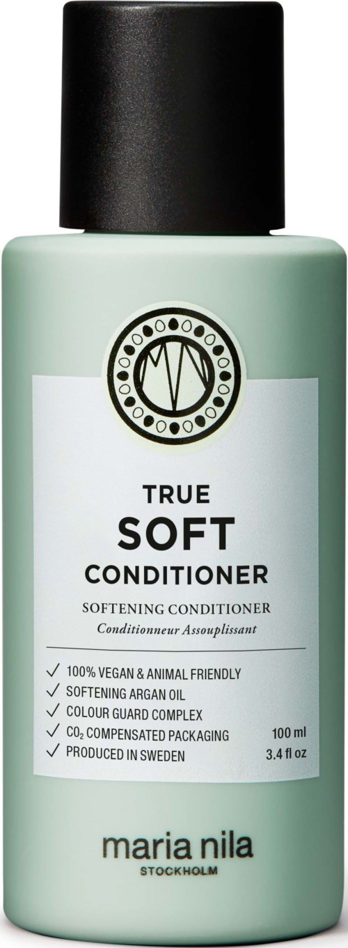 Een groene fles Maria Nila verzachtende conditioner met zwarte dop, label vermeldt vegan, cruelty-free en arganolie.