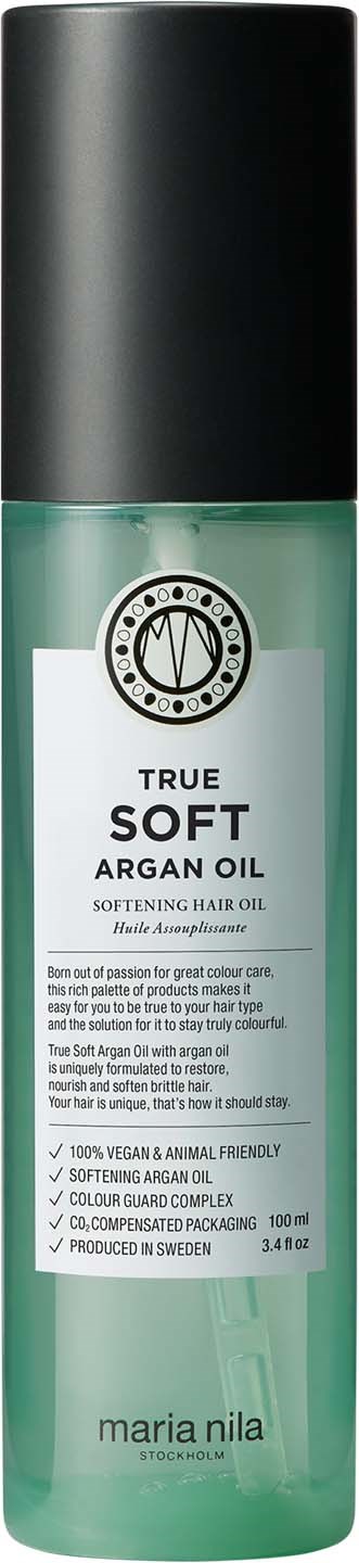 Een lange, groene fles met een zwarte dop, gelabeld als Arganolie voor haarverzachtend, door Maria Nila.