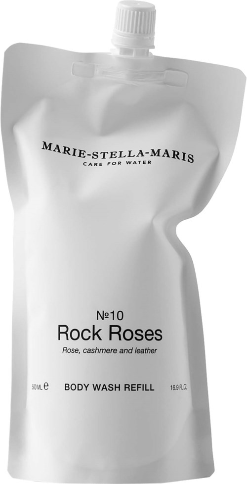 En vit påfyllningspåse för duschgel märkt Rock Roses med doft av ros, cashmere och läder, av Marie-Stella-Maris.