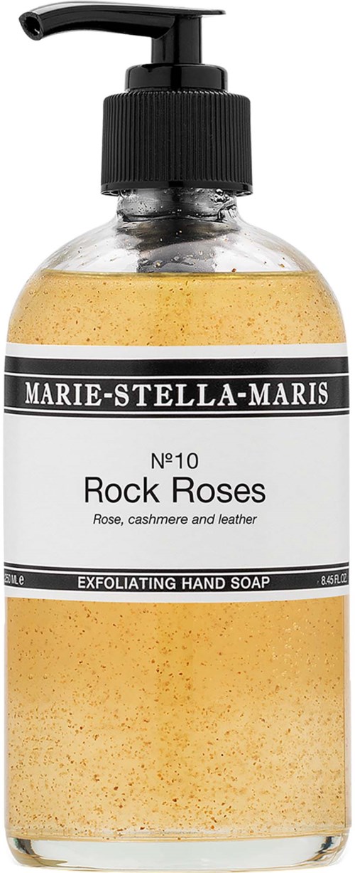 En klar flaska handtvål med svart pump, märkt Marie-Stella-Maris Rock Roses, innehållande scrub-tvål med rosdoft.