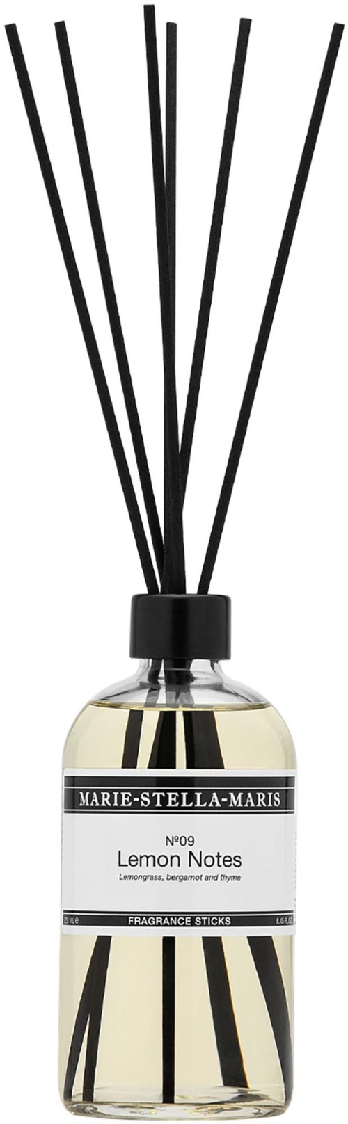 A scent diffuser with black sticks and a white label says Lemon Notes by Marie-Stella-Maris.