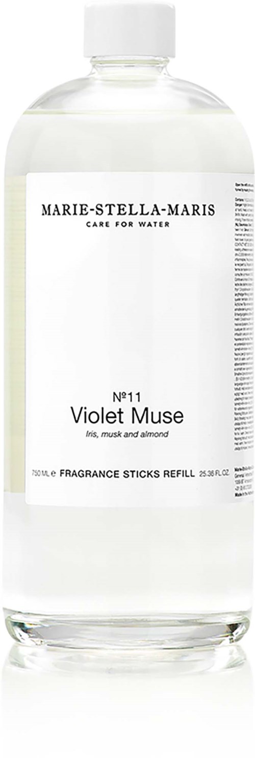 En refillflaska för doftljus märkt Violet Muse med noter av iris, muskot och mandel.