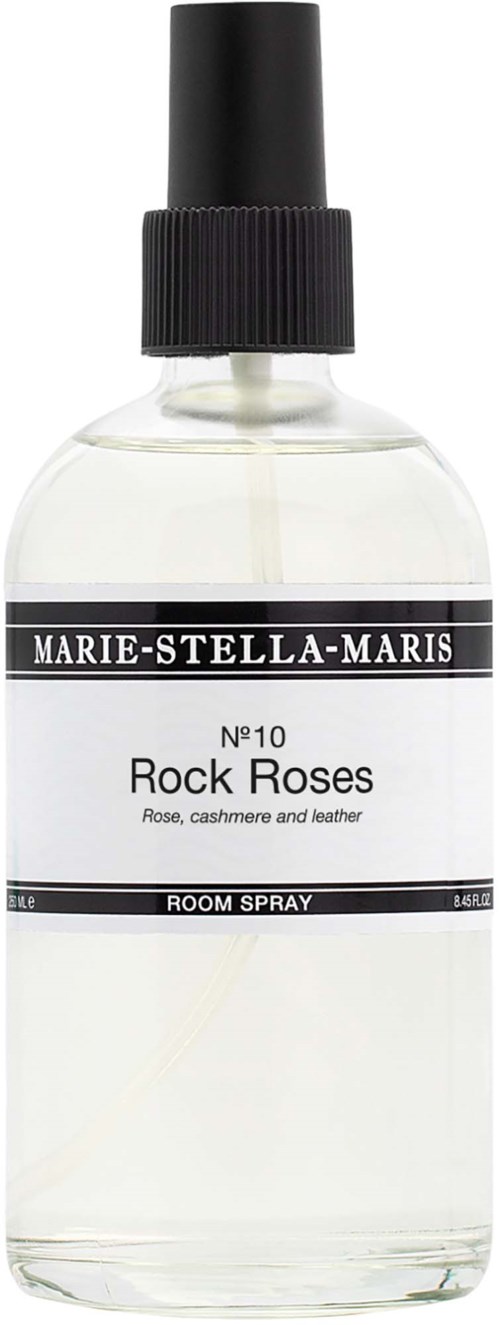 A clear glass spray bottle labeled Marie-Stella-Maris Rock Roses room spray with black cap.