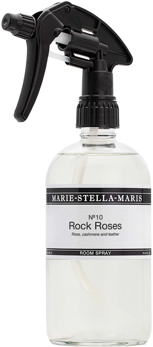 Een sprayfles met het label Rock Roses, zwarte trigger en heldere vloeistof.