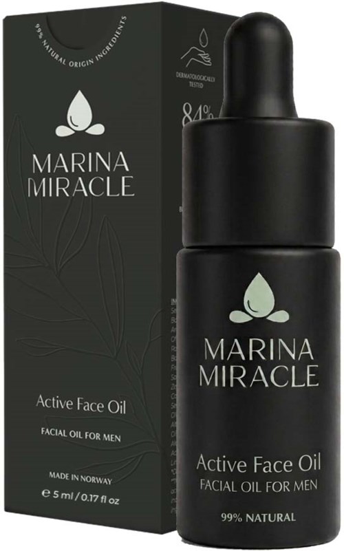 En svart flaske med dråpehette ved siden av en svart eske, begge merket Marina Miracle Active Face Oil for Men, naturlige ingredienser.