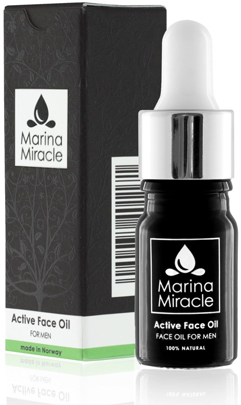 Kleine schwarze Flasche mit Pipette, beschriftet Marina Miracle, neben einer schwarzen Schachtel. Enthält Gesichtsöl für Männer.