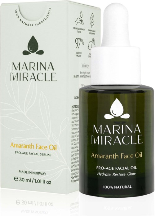 Eine dunkelgrüne Flasche Marina Miracle Amarnath Face Oil mit Tropfer neben weißer Verpackung.