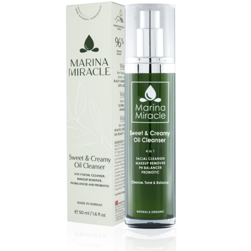 Eine grüne Flasche mit weißem Pumpen und eine Box daneben, beide gekennzeichnet Marina Miracle Sweet & Creamy Oil Cleanser.