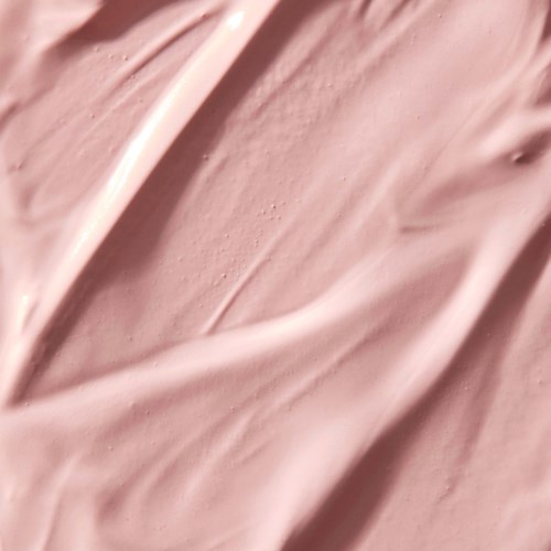 Close-up van roze, romige, getextureerde substantie met brede streken.