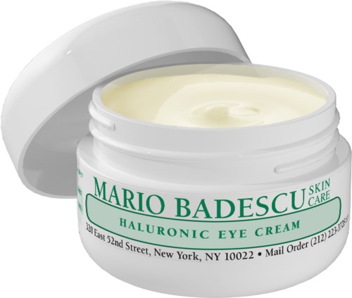 A white jar of cream labeled "Mario Badescu Skin Care" for eyes with a green cap. The lid is open, showing the cream inside.