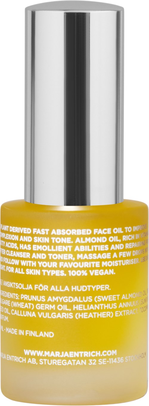 A yellow bottle with a silver cap, containing face oil, labeled with benefits and ingredients. Made in Finland.