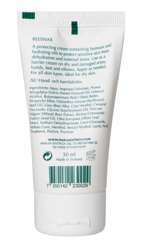 A white tube of beeswax hand cream with green cap, detailed ingredients listed, and barcode at the bottom.