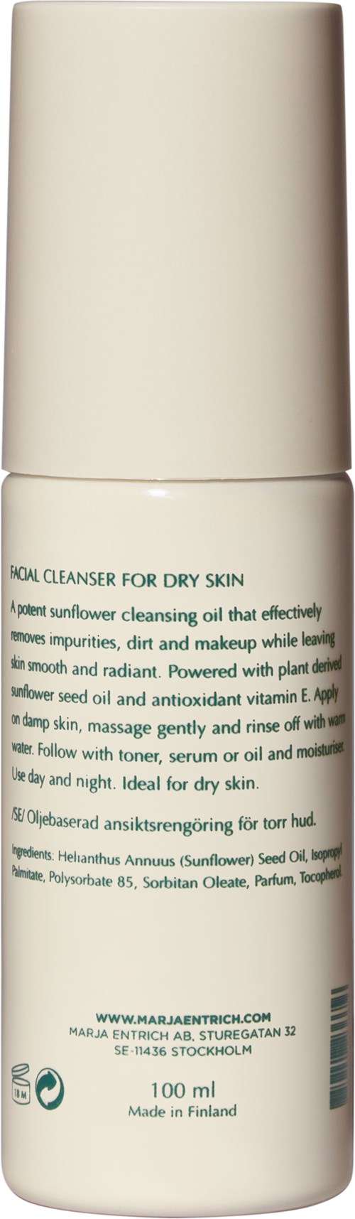 A white bottle with green text offering a facial cleanser for dry skin. It contains sunflower seed oil and antioxidants.