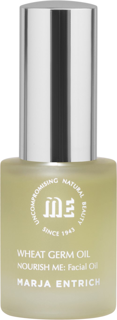 A small bottle of facial oil with a silver cap, labeled with brand and product details.