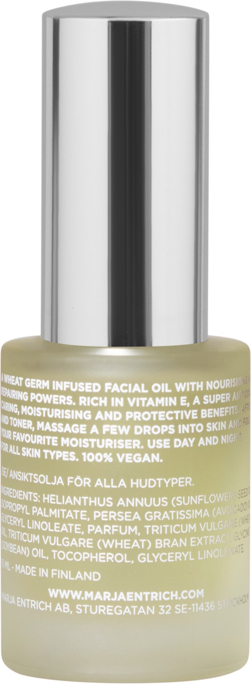 A small glass bottle with a silver cap, labeled as facial oil containing natural ingredients, designed for skincare.