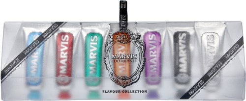 Set of six Marvis toothpaste tubes in different colors, with a black toothbrush in a transparent case.